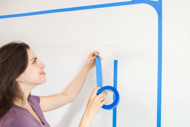 The next step in this DIY bold bar project is to tape along the pencil lines with painter's tape to create a border.